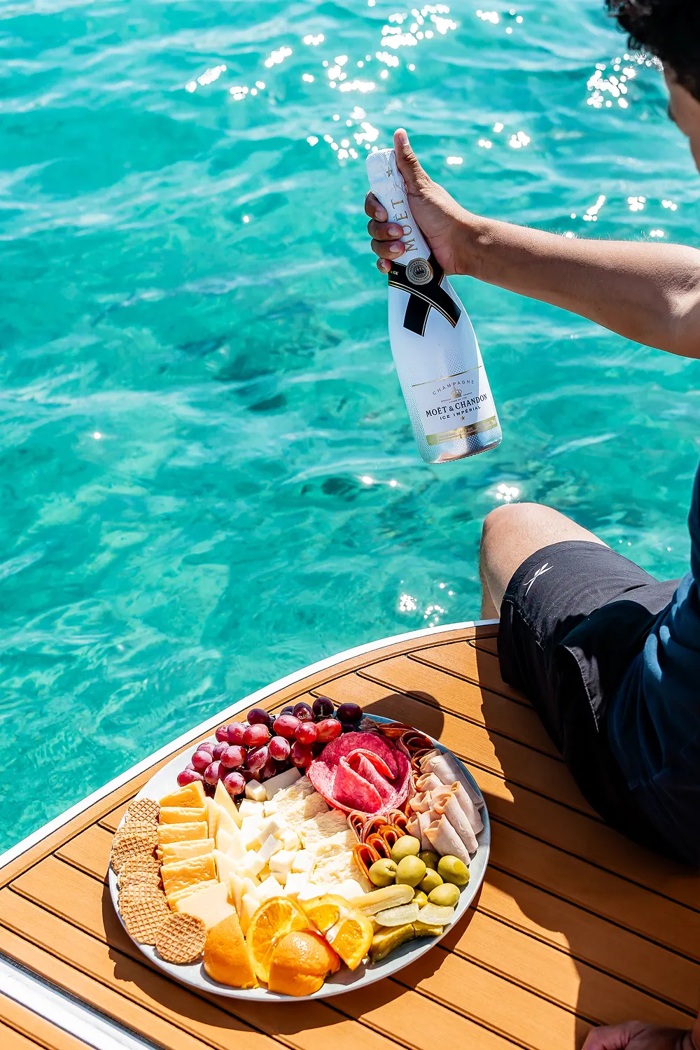 Champagne and a cheese platter served on the bow of Eden Luca Red